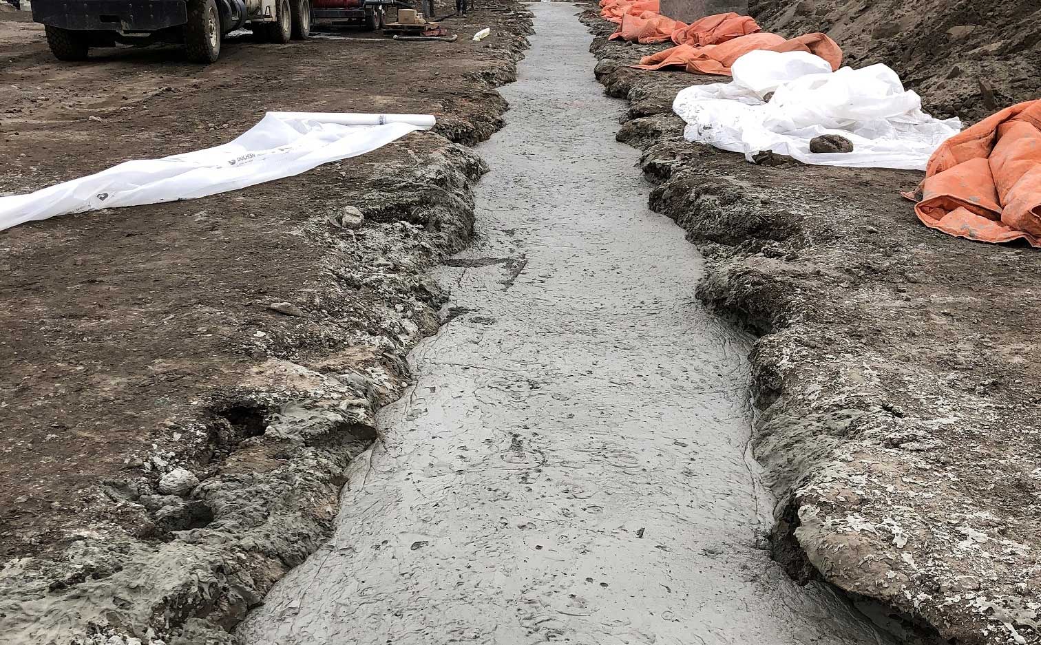 Piping after being buried in concrete at the Blue tubing at the Komatsu Manufacturing Plant