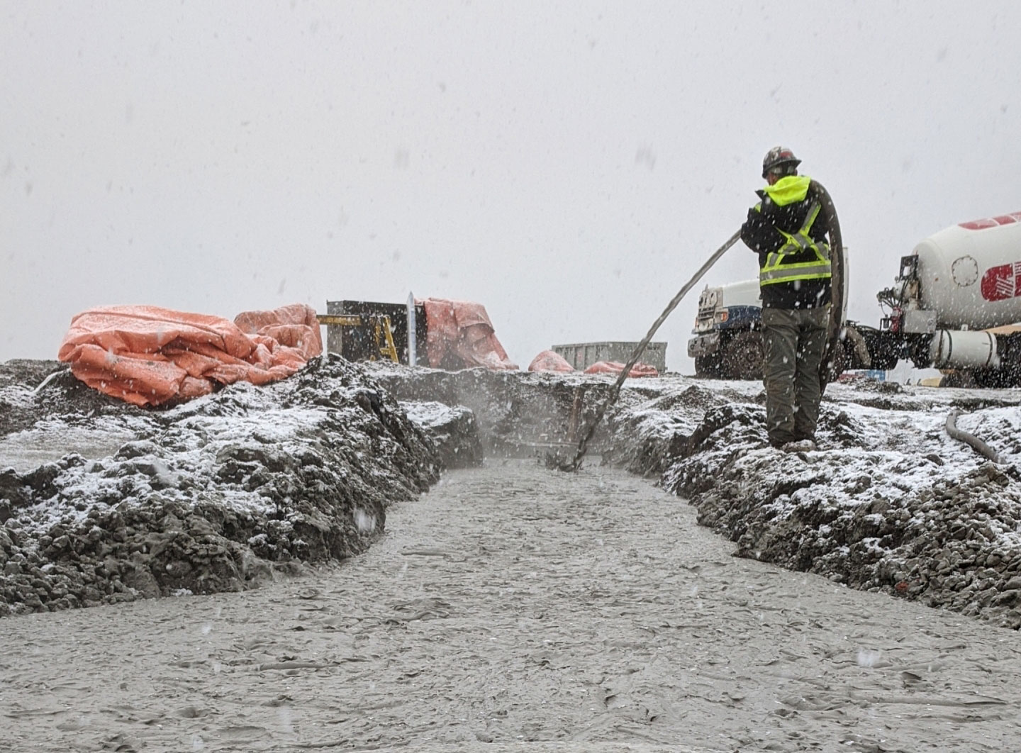 Concrete being poured at the Komatsu Manufacturing Plant in winter