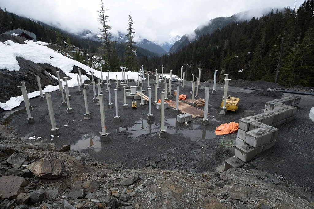 Several concrete and steel pillars staggered in a circular pattern